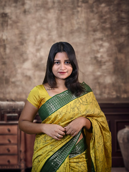 Elegant Kolkata Silk Saree with golden jari work border – traditional Indian festive wear.